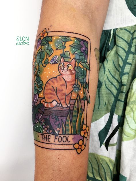 Hercules the orange cat as The Fool on the tarot card tattooed on Lucinda's arm! Cat Memorial Tattoo Traditional, Orange Cat Tattoo Traditional, Cat Tarot Tattoo, Dog Tarot Card Tattoo, Sunflower Cat Tattoo, Cat In A Box Tattoo, Cat Sun Tattoo, Cat Tattoo Orange, Cat Tarot Card Tattoo