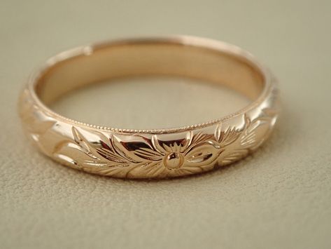 "This half round wedding band can be made in 14k, 18k gold and platinum. Ring is beautify carved with a floral pattern design and millgrained, and high polish all round on all sides. The band is approximately 3.5 mm wide and the thickness is 1.75mm. We can make it any size from 5 to 7 and you still be able to return it within the listed time frame. Sizing outside of that range makes it a FINAL SALE. We love this ring because it represents the way jewelry should be made with craftsmanship and qua Carved Gold Ring, Floral Gold Ring, Floral Engraved Wedding Band, Vintage Gold Wedding Band, Patterned Wedding Band, Floral Wedding Band, Hand Engraved Wedding Band, Flower Wedding Band, Wedding Bands Vintage