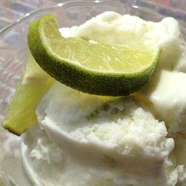 Coconut Lime Ice Cream - Automatic Ice Cream Maker Recipe Recipe | Allrecipes Recipes For Ice Cream Maker, Ice Cream Maker Recipe, Lime Ice Cream, Mango Slices, Ice Cream Party Theme, Recipes Ice Cream, Lime Sherbet, Ice Cream Maker Recipes, Fried Ice Cream