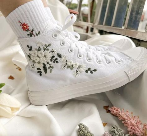 Custom Embroidered Converse - Art Meets Everyday Style Step into style with these Converse High Tops featuring intricate embroidery like magic mushroom clusters, floral designs, custom logos, and even birth month flowers. Every pair is crafted with care to bring a unique blend of tradition and modern fashion to your wardrobe. As someone raised in a family with a rich embroidery heritage, I've taken this timeless craft and transformed it into wearable art. From shoes to t-shirts, jeans, and backpacks, each item is designed to make everyday pieces truly special. Have a design in mind? I'd love to bring your vision to life! For a small fee of $10-$50 (based on complexity), I can create custom embroidery tailored to your style. Message me directly on Etsy with any questions or custom requests- Custom Converse High Tops, Converse Haute, Sneakers Wedding, Bridal Converse, Converse Wedding, Cute Converse Shoes, Embroidered Sneakers, White Bouquets, Embroidered Converse