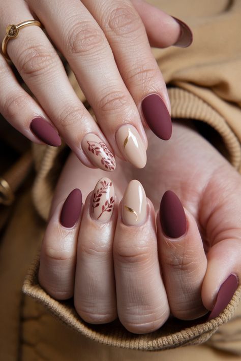 Embrace the season with these charming fall nail ideas designed for your natural nails. Picture warm, earthy tones like deep burgundy and mustard yellow, creatively swirled together for a cozy aesthetic. Add a hint of delicate gold sparkles to elevate your look, capturing the essence of autumn leaves. This style is perfect for anyone who wants a subtle yet striking way to celebrate the season. Get inspired and bring autumn to your fingertips! Burgundy Bridal Nails Wedding, November Nails Matte, Simple Pattern Nails, Crimson Nail Designs, Fall Bride Nails, Nails That Go With A Red Dress, Unique Bridal Nails, Fall Wedding Nails Bridesmaid, Fall Bridal Nails