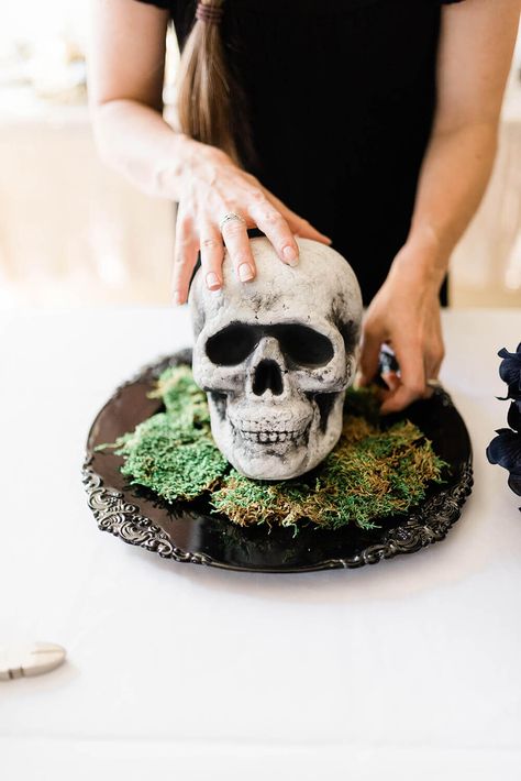 Bed of moss. If you love elegant gothic halloween decor you'll love this easy DIY floral skull centerpiece for your next Halloween Party! Try purple hydrangeas or black roses for creepy but classy Halloween decor. Find out how easy it really is at PartiesWithACause.com #diyhalloween #halloweendecor #centerpieceidea #spookyhalloween Moss Centerpiece, Scorpio Style, Skull Centerpiece, Gothic Halloween Decor, Centerpiece Tutorial, Halloween Witch Cauldron, Moss Centerpieces, Sugar Skull Decor, Purple Hydrangeas