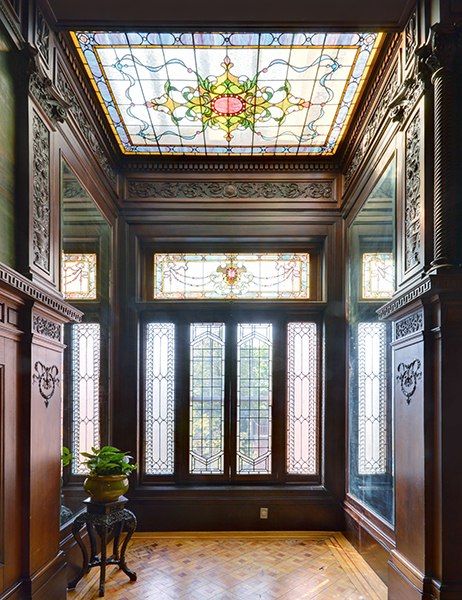 The interiors feature exquisite original details, including coffered ceilings, inlaid parquet flooring, wood paneling, hand-painted frescoes and murals, and stained-glass accent windows. Victorian Life, Brooklyn Brownstone, Victorian Interior, Victorian Interiors, زجاج ملون, This Old House, Architectural Digest, Historic Homes, Stained Glass Windows