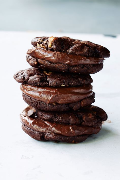 Prepare to abandon all restraint when you try one of these cookies made with melted chocolate and chocolate chips and layered with a chocolate ganache filling. Breakfast Pudding, Best Holiday Cookies, Best Chocolate Desserts, Christmas Delights, Small Treats, Chocolate Cookie Recipes, Holiday Cookie Recipes, Delicious Cookie Recipes, Chocolate Dessert Recipes