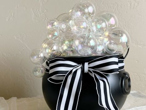 Build a bubbling cauldron with Christmas ornaments! This easy DIY takes just 20 minutes Ornament Cauldron, Cauldron With Bubbles, Diy Cauldron, Dollar Tree Halloween Decor, Bubbling Cauldron, Dollar Tree Halloween, Halloween Centerpiece, Clear Ornaments, Witches Cauldron