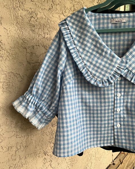 👚 Collared cuties 😍😍 Peter Pan collars, gingham, cottagecore aesthetic and alllll those ruffles are still THE moment right now— why not dive in? I loved creating these custom blue gingham and black gauze blouses for a client, based on the original floral version that I have in my inventory! 🌸 Swipe ➡️ to the end to see all of the fabrics I have available to make this top out of! Sizes XS-3X are all possible (depending on specific fabric choice). For my locals, don’t forget that I’ll be at... Peterpan Collar Blouses, Collar Blouse Outfit, Gingham Cottagecore, Peterpan Collar, Pan Collar Blouse, Peter Pan Collar Top, Peter Pan Collar Blouse, Peter Pan Collars, Upcycled Clothing