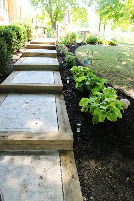 Blogger Elizabeth of Ohio Thoughts needed a walkway in between her back door and garage. She made this one using salvaged wood beams and concrete. Check out more of our favorite DIY garden paths. Cheap Landscaping Ideas, Backyard Walkway, Concrete Patios, Pathway Landscaping, Garden Stairs, Garden Stepping Stones, Garden Walkway, Easy Backyard, Garden Steps