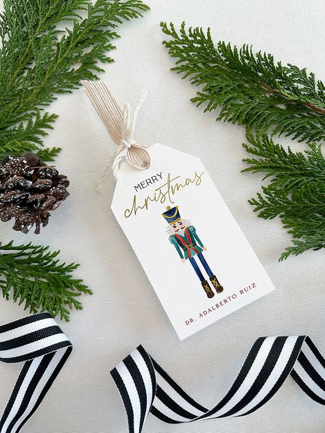 "▪ DESCRIPTION ▪ Dress up every Christmas gift that leaves your hands with these personalized Nutcracker gift tags! You can also use them as favor tags. You can buy them as an addition to your own desk, or as the perfect Christmas personalized gift for someone special. * Set of 12 2.5\" x 4.5\" gift tags. * Paper: fine 120# eggshell. Felt paper upgrade is available on our website. * Printing method: digitally printed with foil-pressed details. Foil-pressed name upgrade is available on our websit Xmas Prints, Custom Christmas Gift Tags, Christmas Name Tags, Custom Hang Tags, Christmas Gift Tags Personalized, Stocking Tags, Christmas Stationery, Christmas Favors, Creative Gift Wrapping