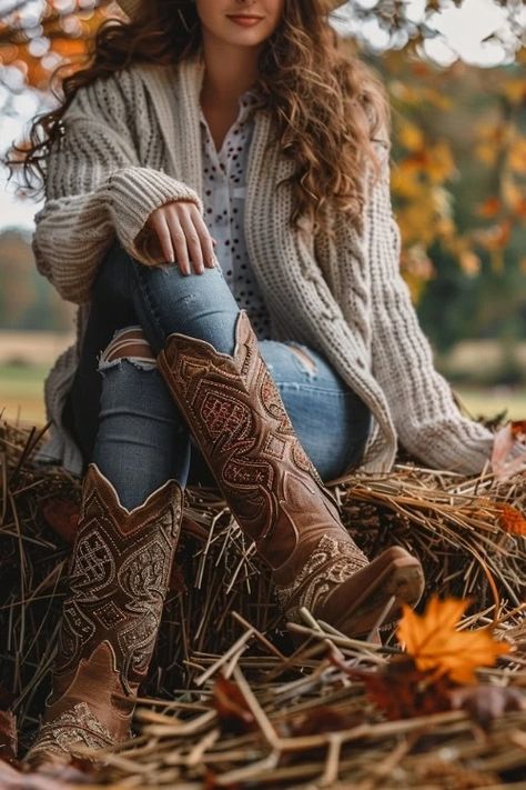 https://www.fromtheguestroom.com/wp-content/uploads/2024/08/A-woman-wears-ripped-jeans-brown-cowboy-boots-and-cardigan.webp 2024 Fall Boots Outfits, Cowgirl Modest Outfits, Christmas Outfit With Cowboy Boots, Maroon Cowboy Boots Outfit, Cowgirl Style Outfits Fall, How To Wear Western Boots, Western Fall Outfits Women, Chestnut Boots Outfit, Fall Outfits Cowboy Boots