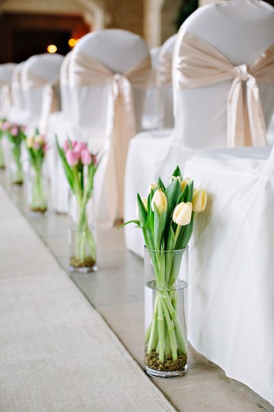 What a great idea to line the aisles! Here, simple arrangements of beautiful tulips add color and charm. Shop tulips year-round in a variety of stunning colors at GrowersBox.com! Wedding Flowers Tulips, Tulip Decor, Tulip Wedding, Ballroom Wedding, Aisle Decor, Deco Floral, Wedding Aisle, Wedding Table Centerpieces, Beautiful Picture