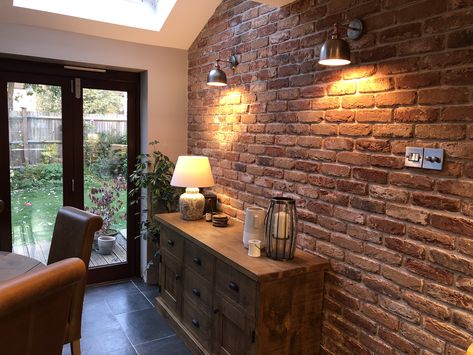 Never used brick slips before, but love the cosy feel they bring to our kitchen! Brick Slips Dining Room, Exposed Brick Walls Cottage, Brick Feature Wall Ideas, Brick Slip Wall Living Rooms, Brick Feature Wall Dining Room, Brickslips Wall, Open Brick Wall Living Room, Slip Brick Wall, Brick Slips Living Rooms