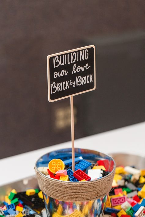 It's easy to get preoccupied by building blocks like Legos—which works in your favor if you're looking for a way to distract little ones. Kids Entertainment Wedding, Wedding Games For Kids, Fun Signage, Kids Table Wedding, Lego Wedding, Brick By Brick, Kids Wedding Activities, Wedding Guest Book Unique, Wedding Activities