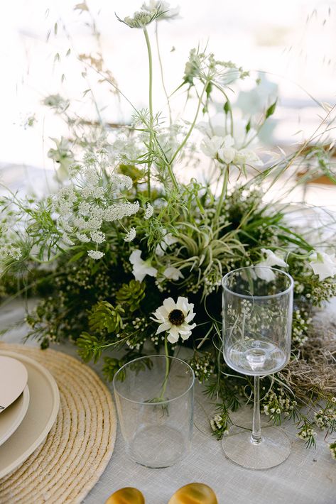 Planning a wedding can be a daunting task, but with the right inspiration, it can be a fun and exciting process. Here are some wedding reception centerpiece ideas to help you get started. Wedding Tablescapes Greenery, Green Wedding Flowers Centerpiece, Greenery Heavy Wedding, Greenery At Wedding, Wedding Floral Table Arrangements, Moss Floral Arrangements, Moss Wedding Centerpiece, Greenery Centerpiece Wedding, Moss Tablescape