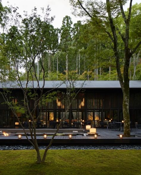 The exterior of the Aman Kyoto hotel, a black-single story building with lanterns and trees surrounding it.    Idyllic hotels and resorts in breathtaking locations with a serene aesthetic and unmatched hospitality. Aman Kyoto Hotel, Aman Kyoto, Kyoto Hotel, Travel Agent Career, Serene Aesthetic, Bucket List Hotels, Africa Trip, 2024 Travel, Usa Trip