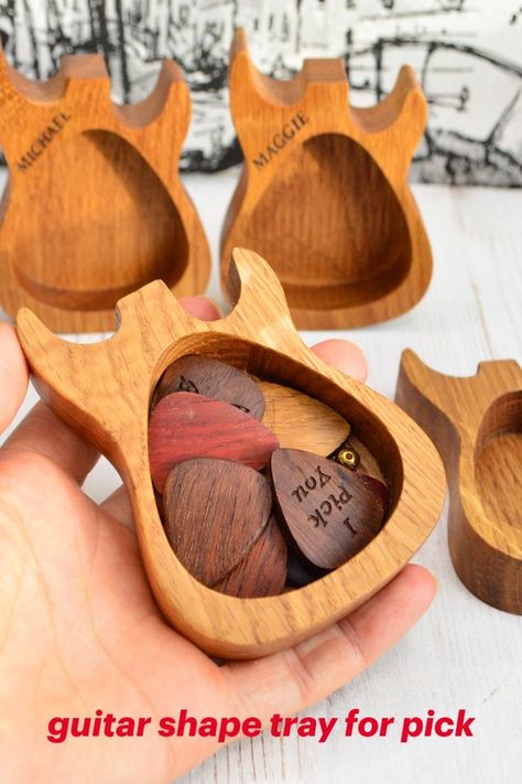 Wooden tray in the shape of an electric or acoustic guitar for picks or small items.
A tray for guitar picks or small items will be a great gift for a musician, for him or his father on his birthday, Valentine's Day or Father's Day. On the tray, you can engrave a name on the front side and / or a short message on the back side. We make all our products only from natural eco-friendly wood and cover them with safe oil and beeswax 
Size 10x7x2 cm ( 4" 2.75" 0.8") Guitar Pick Box, Personalized Key Holder, Guitar Lover, Wooden Guitar, Best Friend Day, Guitar Gifts, Guitar Lovers, Musician Gifts, Music Decor