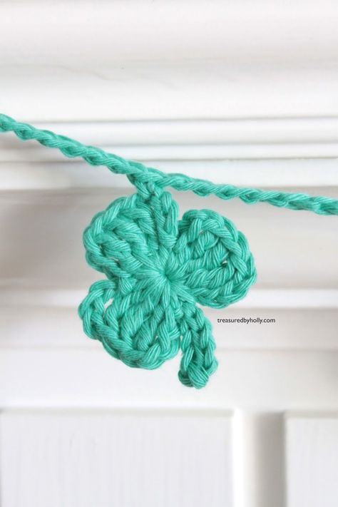 If you're in search of a little bit of luck this St. Paddy's Day, then these cute little Shamrock's are just what you need. Make a garland for your mantel or sweet little hair clips for your littles. Either way, they will become a fun addition for your home and family. Crochet Shamrock Crochet Clover Garland, Crochet Shamrock Free Pattern Amigurumi, Crochet Shamrock Applique Free Pattern, St Patrick’s Day Crochet Garland, Crocheted Shamrocks Free, Shamrock Crochet Pattern, St Patricks Crochet Patterns, Shamrock Crochet Pattern Free, Crochet Shamrock Free Pattern