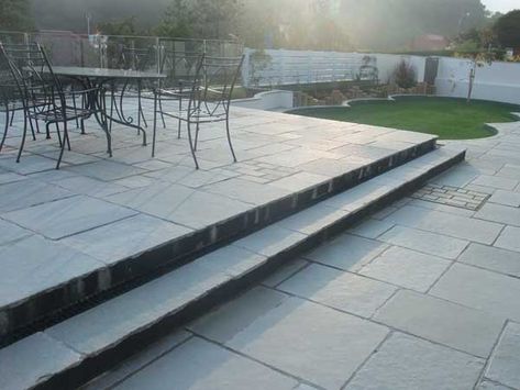 You may have a natural slope in your garden or just wish to create different levels to add interest, so why not consider building a split level patio? Slate Deck, Deck Walkway, Modern Garden Patio, Garden Bar Shed, Limestone Paving, Bar Shed, Patio Pavers Design, Garden Paving, Lawn Furniture