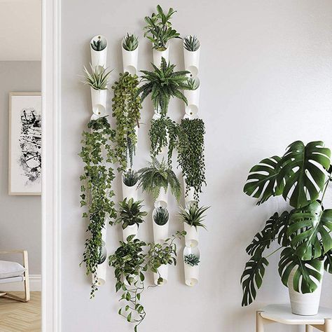 Decorating a large blank wall doesn't have to be overwhelming. These design ideas will help you add style and character to any boring wall! Wall Plants Indoor, Indoor Plant Wall, Hanging Vase, Plants Hanging, Support Pour Plante, نباتات منزلية, Plant Wall Decor, Hanging Plants Indoor, Plant Room