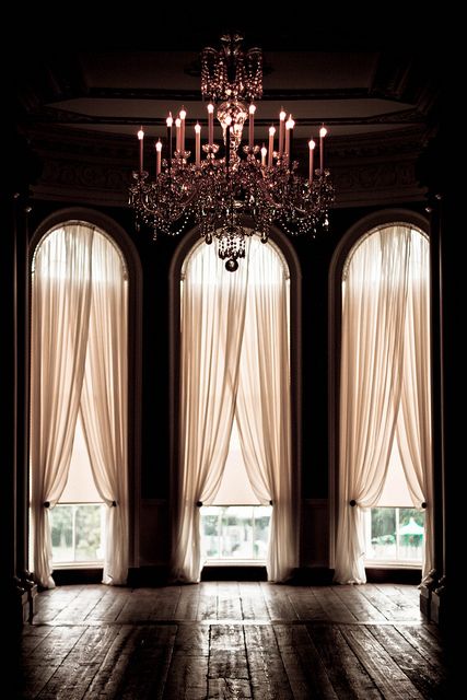 arched high windows, dramatic curtains + antique chandelier. we can dream Oasis Decor, Desert Oasis, Pool Design, Window Dressings, The Ceiling, Style At Home, Beautiful Space, My New Room, Home Fashion