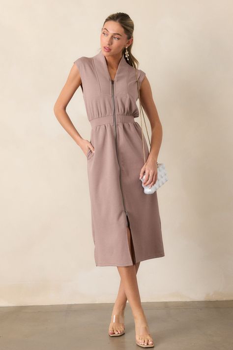 Discover effortless elegance with our Distant Sun Dark Taupe Sleeveless Midi Dress! Perfect for any occasion, this midi dress will keep you comfortable and stylish all day long. Its versatile design makes it easy to dress up or down, providing endless possibilities for your wardrobe. Elevate your style today! This taupe dress features a v-neckline, a slight collar, a functional zip front, functional hip pockets, and an elastic waistband.
50% Cotton, 43% Polyester & 7% Spandex 
Unlined 
Hand Wash Cold 
Manufactured in China 
Designed in The USA 
Model is wearing a size small 
Model is 5'8" Taupe Dress, China Design, Dark Taupe, Sleeveless Midi Dress, Effortless Elegance, Midi Dress Sleeveless, Endless Possibilities, Red Dress, Dress Up