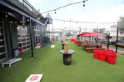 Our outdoor playground with numerous bar games. - Varsity Tavern - Fort Worth, TX Outdoor Bar And Grill, Patio Games, Outdoor Bar Area, Restaurant Game, Urban Bar, Gym Bar, Diy Outdoor Bar, Office Photos, Outside Bars