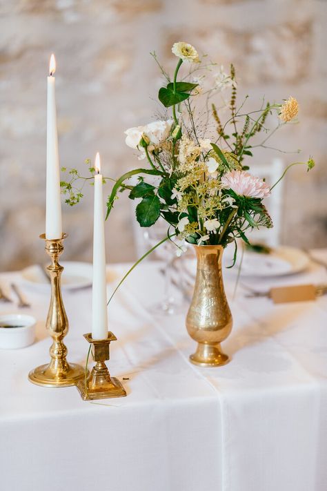 Seasonal summer flowers fill brass vessels lining the top table for a beautiful wedding at Hooton Pagnell Hall | Flowers by Aelisabet Flowers Brass Bud Vases Wedding, Brass Candlesticks Wedding Round Table, Brass Vases Wedding, Brass Vase With Flowers, Vintage Brass Wedding Decor, Brass Centerpiece Wedding, Brass Centerpieces, Brass Vase Wedding, Gold Bud Vases