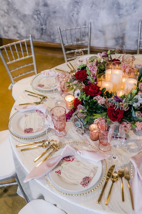 Gorgeous burgundy and pink centerpiece with touch of purple and gold. Wedding menus and gold flatware accents. #daytonwedding #cincinnatiwedding Burgundy Gold Pink Wedding, Pink And Maroon Wedding, Burgundy Blush And Gold Wedding, Burgundy Pink Wedding, Burgundy And Pink Wedding, Champagne Wedding Themes, Princess Wedding Theme, Pink And Burgundy Wedding, Pink Wedding Receptions