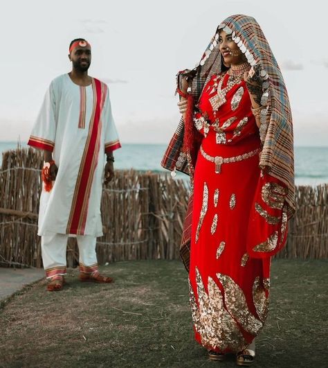 An original version of the most distinctive traditions, habits, customs, and lifestyles can be found created by the Nubians, and one distinctive tradition of them is the "Nubia Marriage”. The Nubian Marriage is way more distinguished from the weddings that nowadays are conducted in Egypt. For the Nubians, the celebration continues for 7 days, in a span, for the bride alongside 7 days for the groom. #EgyptToursPortal #nubianvillage #culture #Nubia #history #nubianpeople #EgyptianCulture Sudanese Clothing, Nubian Village, Egyptian Wedding, Nubian Heritage, Maasai People, Male Outfits, Cultures Around The World, Egypt Tours, Culture Clothing