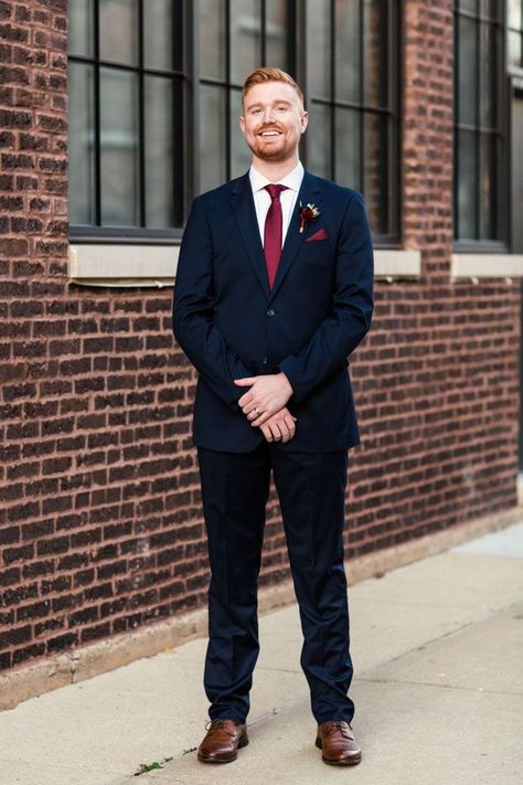 Colorful groom outfits: a dark navy suit paired with maroon boutonnière, pocket square, and tie | Image by Emma Mullins Photography Navy Suit Burgundy Tie, Burgundy Tie Wedding, Navy And Burgundy Suit, Colorful Groom, Dark Navy Blue Suit, Fall Chicago, Dark Navy Suit, Wedding Motif, Navy Groom