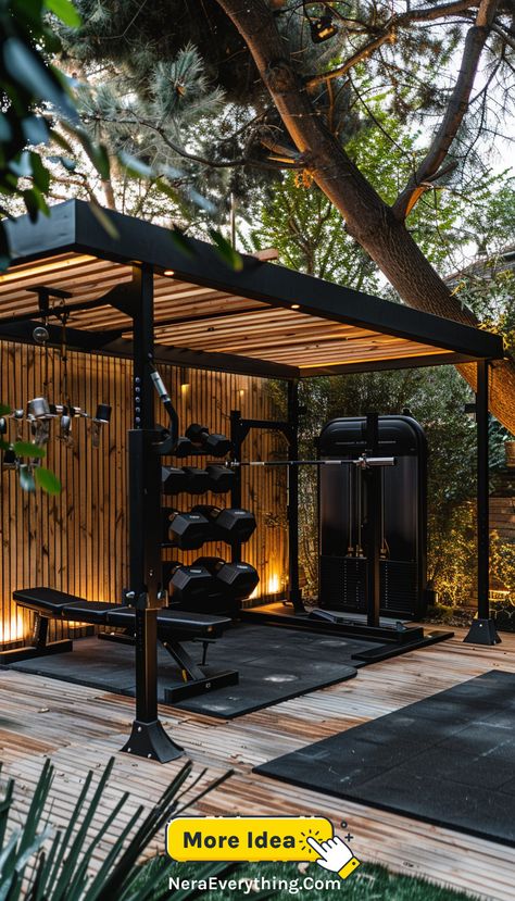 An outdoor home gym with a covered area, natural surroundings, and a variety of fitness equipment for a serene and invigorating workout environment. Outdoor Home Gym Ideas, Small Outdoor Gym Ideas, Small Garden Gym Room, Home Outdoor Gym, Outdoor Workout Space, Outdoor Mancave Ideas, Terrace Gym Ideas, Weight Room, Backyard Gym Ideas