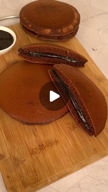 7.7M views · 344K likes | Alisha Bansal on Instagram: "Chocolate Dora Cake 🥞

For complete detailed recipe, link 🔗 is in bio 

Follow @anyonecancookwithdr.alisha for more such easy recipes 

#doracake #chocolatedoracake #chocolatecake #nutellacake #chocolateganache #cake #1mincake #cakeparty #kidsfavouritecake #dorayaki #dorayakicake #dora #doremon  #kids  #tasty #easy #recipes #cakeforkids #baking #nobakecake #tawacake #foodies #foodblogger #foodvlogging #lifeoffoodvlogger #japanesefood #pancakes #japanesecakes" Tasty Easy Recipes, Dora Cake, Nutella Cake, Delicious Snacks Recipes, Indian Food Recipes Vegetarian, Easy Cake Recipes, Daily Prayer, Chocolate Ganache, Yummy Snacks