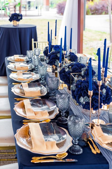 Samantha’s Garden Wedding Blue And Gold Plates Table Setting, Blue White And Gold Table Setting, Deep Blue Party Decorations, Blue Table Settings Party, Blue Dinner Party Decor, Gold And Blue Party Decor, Royal Blue 60th Birthday Party, Navy Blue Engagement Party Decorations, Blue Gold Wedding Centerpiece