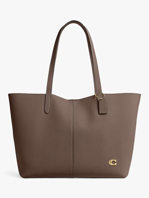 Sticking to the same large, boxy shape, this tote has been reimagined by Coach. Crafted from leather that'll last for years to come, it secures with a magnetic closure. Coach Shopping Bag, Coach Bags Tote, Handbag For School, Bags Tote, Tote Bag Coach, Bags For University For Women, Large Purse, Leather Tote Bags, School Handbag