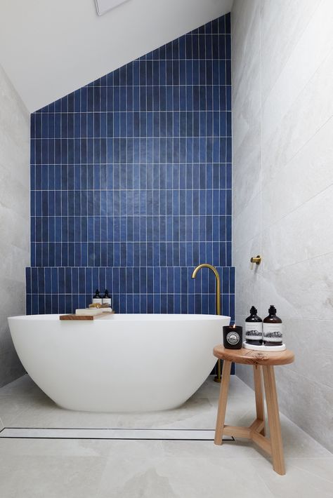 Indigo blue feature wall in bathroom Blue Tile Feature Wall Bathroom, Vertical Blue Subway Tile Bathroom, Blue Vertical Tile Bathroom, Blue Subway Tile Bathroom, Ensuite Tiles, Blue Feature Wall, Blue Subway Tile, Blue Bathroom Tile, Subway Tiles Bathroom