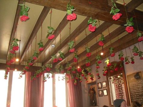 Roses hanging from the ceiling How To Hang Roses From Ceiling, Upside Down Roses Decor, Rose Ceiling Decor, Roses Hanging From Balloons, Valentines Ceiling Decorations, Red Roses Hanging From Ceiling, Rose Hanging From Ceiling, Falling Roses Ceiling, Roses From Ceiling