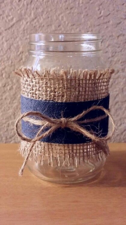 Dollar store mason jar, burlap, denim ribbon, and twine. So quick and easy to make. Denim Centerpieces, Denim Centerpiece Ideas, Denim Table Decor, Mason Jar Burlap, Denim Baby Shower, Diamonds And Denim Party, Denim Ribbon, Denim And Pearls, Wedding Jars