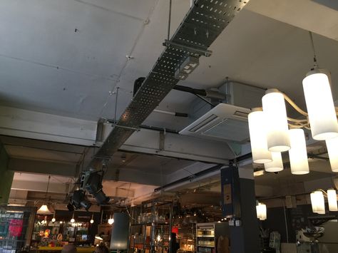 Not totally sold on Pitfield Cafe's ceiling - the components are right, and I like the heavy duty spots suspended from cable trays, but it feels a bit shabby and not-thought-about also. Industrial Accessories, Cable Trays, Office Ceiling, Industrial Office Design, Rustic Office, Cable Tray, Window Grill Design, Window Grill, Tray Ceiling