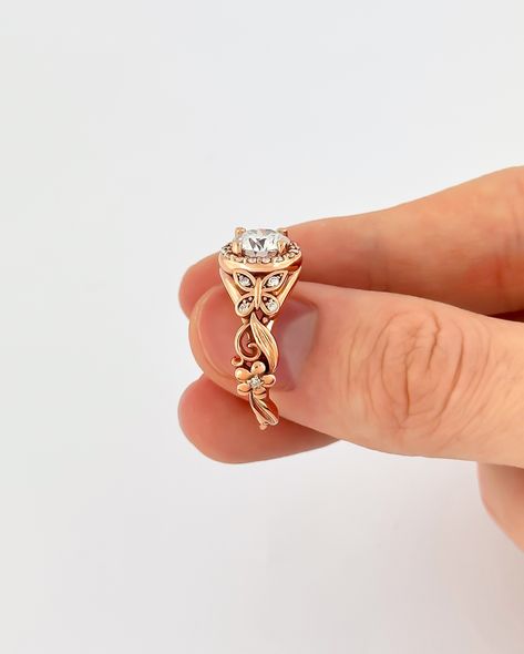 A butterfly engagement ring beautifully adorned with glistening diamonds 😍 Butterfly Engagement Ring, Butterfly Rings, Gold Butterfly Ring, Rose Gold Butterfly, Nature Inspired Engagement Ring, Unique Butterfly, Engagement Ring Rose Gold, Moissanite Wedding Rings, Butterfly Ring