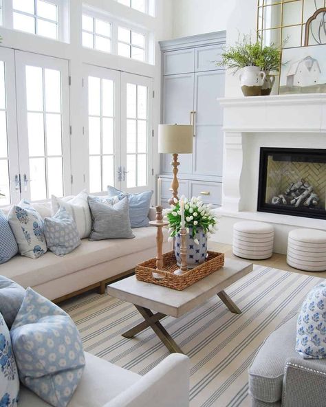 Light Blue And Navy Living Room, Stools In Front Of Fireplace, Light Blue Accents Living Room, Modern Coastal Family Room, Nantucket Style Living Room, Blue And Neutral Living Room, Blue Accent Living Room, Coastal Sitting Room, Living Room With Blue Accents