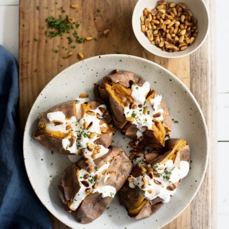 Amelia Freer's baked sweet potatoes with coconut yoghurt dressing - Red Online Happy Gut Recipes, Dopamine Diet, Amelia Freer, Fresh Cranberry Recipes, Gut Recipes, Pine Nut Recipes, Red Magazine, Yoghurt Dressing, Baked Sweet Potatoes