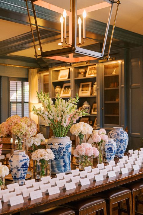 Chinoiserie escort card table with white and blush florals. Escort card wedding table. Chinoiserie Flower Arrangements, Oyster Wedding, Chinoiserie Wedding, Table Pc, Blue Weddings, Card Table Wedding, Cricket Club, Card Table, Wedding Arrangements