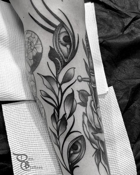 Black and white tattoo of a vine of leaves with eyes on it to gap fill in between other tattoos. #tattoo #tattoos #tattooideas #tattootips #tattooinspo #tattooinspiration #blackandwhitetattoo #floraltattoo #naturetattoo Vine With Eyes Tattoo, Eye Leaf Tattoo, Fill Tattoo, Black And White Tattoo, Eyes Tattoo, Tattoos Inspo, Piercings Jewelry, White Tattoo, Eye Tattoo