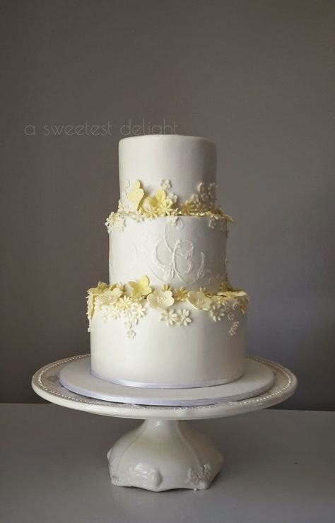 Pale yellow classic wedding cake Navy Blue And Pastel Yellow Wedding, Pale Yellow Wedding Cake, Pastel Yellow Wedding Cake, Lemon Yellow Wedding Theme, Light Yellow Wedding Cake, Light Yellow Wedding Theme, Pastel Yellow Wedding Theme, Pale Yellow Wedding Theme, Pastel Yellow Wedding