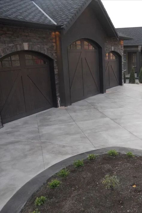 Beautiful Driveway Ideas; whether you want to use concrete, pavers, or gravel on your driveways, here are some driveway options and designs to choose from! Front Of House Concrete Ideas, Concrete And Asphalt Driveway, Scored Concrete Driveway, Long Concrete Driveway, Concrete And Paver Driveway, Stamp Concrete Driveway, Patio Landscaping Border, Driveway Stone Ideas, Stained Driveway Concrete