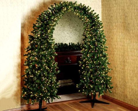 www.thegreenhead.com/2006/12/pre-lit-christmas | Pre-lit Christmas Tree Arch - The Green Head Christmas Tree Arch, Mantle Wreath, Tree Arch, Unusual Christmas Trees, House Fireplace, Minimalist Tree, Amazing Christmas Trees, Photo Negative, Pre Lit Christmas Tree