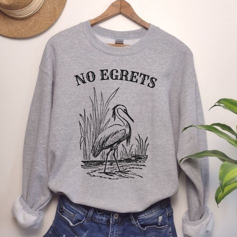 Live your life with no egrets.  This is a classic Gildan unisex sweatshirt with drop sleeves. When you think of a sweatshirt, this is one that should come to mind. If you prefer an oversized look, go up 1-2 sizes.  This design is also available on a tote bag here: https://mythirdfavorite.etsy.com/listing/1729187057 As all of our shirts are made to order, there are no refunds - make sure you are ordering the correct size. If there is any problem whatsoever with the printing or the garment itself, Cute Womens Clothes, Pun Shirts Funny, Outfit Ideas Shirt, Shirt Outfit Ideas, Shirt Design Ideas, Pun Shirt, Nerd Shirt, Pun Shirts, Nerd Shirts