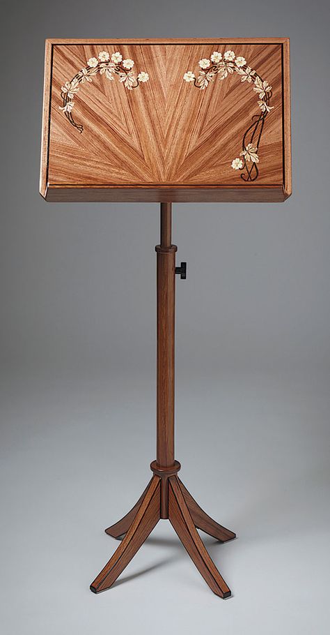 Bubinga Music Stand by Jerry Cousins — Cousins built this music stand as a gift to thank the San Francisco Bay Area chamber music group that puts on a free festival in his rural community each year. “I present them with a music stand to be used for the group, given to a musician, or auctioned as a fundraiser.”  Bubinga, ebony, and wenge 20-1/2W X 44H From FWW 247 Wooden Music Stand, Ukulele Chords Songs, Rural Community, Music Stands, Bedroom Redesign, Guitar Hanger, Ribbon Embroidery Tutorial, Chamber Music, Violin Music