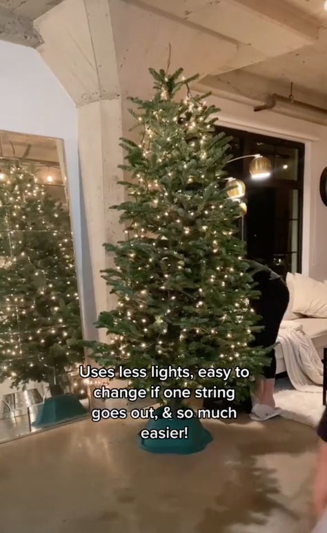 This TikTok Hack For Hanging Christmas Tree Lights Vertically Is A Total Game Changer Decorating Christmas Trees, Lighting Hacks, Hanging Christmas Lights, Christmas Hacks, Hanging Christmas Tree, Xmas Lights, Holiday Christmas Tree, Decorating With Christmas Lights, Diy Christmas Tree