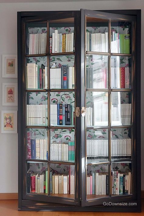 Scaling things up is this tall, wooden antique bookcase with a print that has an enchanting pattern on it to line the insides. Bookcase With Door, Glass Cabinet Bookcase, Book Rack Design With Glass Door, Library With Glass Doors, Library Glass Doors, Bookshelves Glass Doors, Bookshelves With Glass Doors, Bookshelves Ideas For Bedroom, Bookshelves With Doors