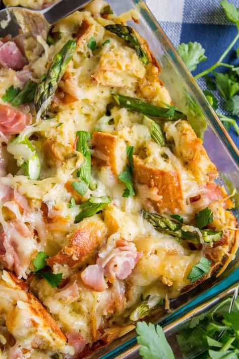 Savory Bread Pudding with Ham and Asparagus from The Food Charlatan. Savory Bread Pudding is the perfect lazy Sunday brunch recipe! I love the flavor from the ham and asparagus, it's perfect for spring and a little different from your average breakfast casserole. It's fast and easy. It would be perfect to make for Mother's Day! The hollandaise sauce makes it so decadent! #Brunch #Breakfast #Casserole #BreadPudding #Easy #Ham #Asparagus #EasyBreakfast #Healthy #HealthyBreakfast #Swiss #Cheese #Br Croque Madame Breakfast Casserole, Savory Breakfast Bread, Breakfast Bread Pudding, Ham And Asparagus, Ham Asparagus, Savory Bread Pudding, Savory Bread Puddings, The Food Charlatan, Bread Puddings